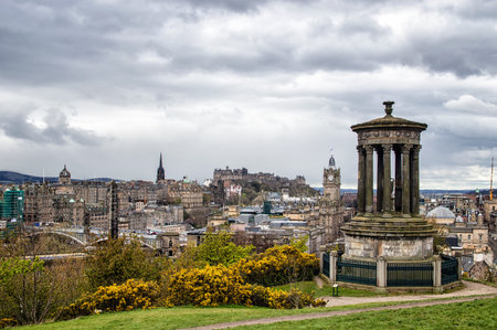 Edinburgh, Scotland - April 26, 2016: Dugald Stewart Monument on Calton Hill in Edinburgh - Edinburgh Castle on the backgroundのeditorial素材