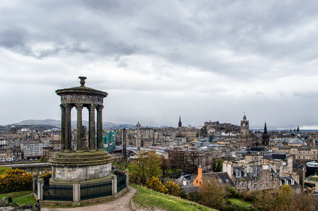 EDINBURGH, SCOTLAND - April 26, 2016: Dugald Stewart Monument on Calton Hill in Edinburgh - Edinburgh Castle on the backgroundのeditorial素材