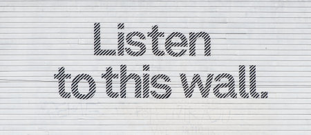 Listen to this wall. Graffiti message on a wall in Haight-Ashbury, San Francisco