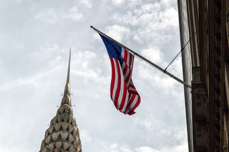 New York, USA, May 10: Chrysler building facade with American Flag in New York, was the world's...