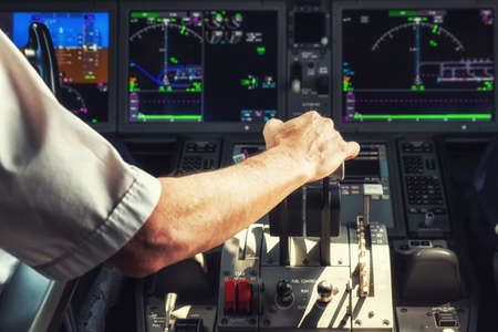 Pilot Operating the Throttle for Taking Offの写真素材