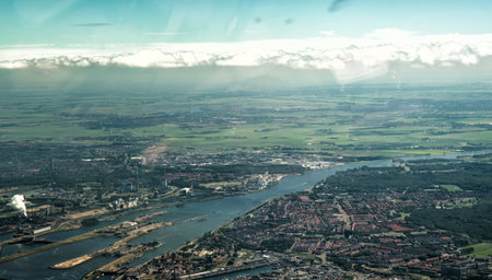 22 June 2016, IJmuiden, Netherlands. Aerial view of sluice in the Noordzeekanaal with the factory of steel producer Tata Steel.のeditorial素材
