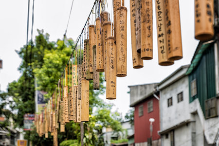 PINGXI, TAIWAN - June 24, 2016: Bamboo Tube for Wishing at Pingxi Old Street. Visitors write their wishes on bamboos then pray and hang them together.のeditorial素材