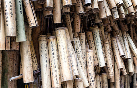 PINGXI, TAIWAN - June 24, 2016: Bamboo Tube for Wishing at Pingxi Old Street. Visitors write their wishes on bamboos then pray and hang them together.のeditorial素材