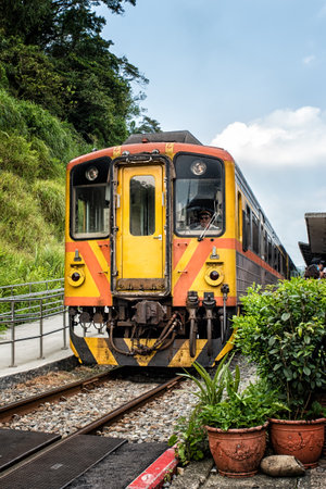 Narrow passage of a train through the Shifen Village near Taipei.のeditorial素材