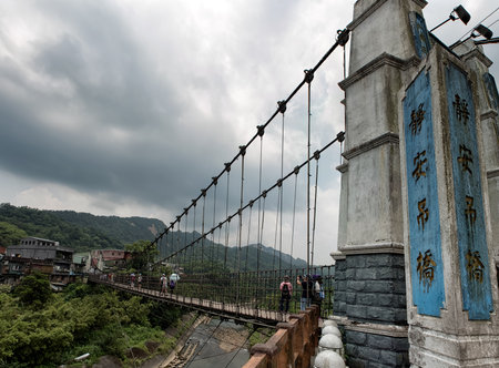 SHIFEN, TAIWAN - JUL 24, 2016: Jingan Suspension Bridge linked between Shifen and Nanshan Village at Shifen, Taiwan.のeditorial素材