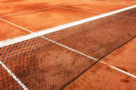 Empty Clay Tennis Court and Net.の写真素材