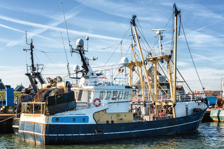 Dutch harbor of Den Oever, Netherlands with modern fishing and trawling boatsのeditorial素材