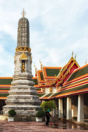 A female worker at Wat Pho Temple, Bangkok, Thailandの写真素材