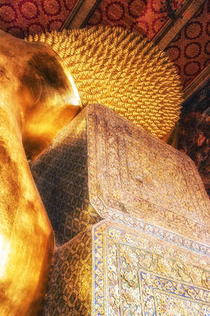 The Head of the Reclining Buddha in Wat Pho, Bangkok, Thailandの写真素材