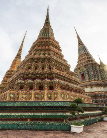 Beautiful spired chedis housing the ashes of royal persons at Wat Pho in the Thai capitalの写真素材
