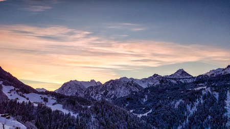 Spectacular sunset over landscape at European alps in winterの写真素材