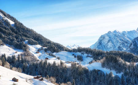 Winter landscape with ski lodge in austrian alpsの写真素材