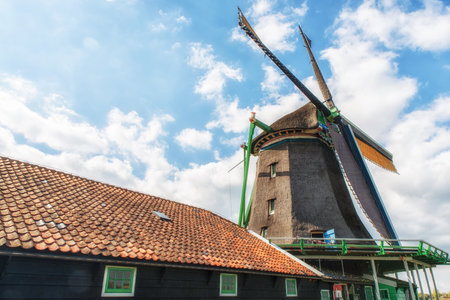 Paint Mill De Kat in Zaanse Schans,Traditional Dutch old wooden windmill in Zaanse Schans - museum village in Zaandam. The Netherlands.のeditorial素材