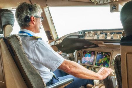 Pilot operating,  navigating airplaneのeditorial素材