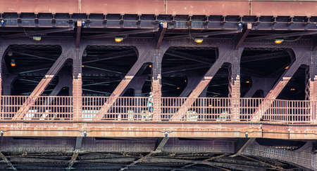 Running on one of the many red bridges in Chicago, Illinois, USAの写真素材