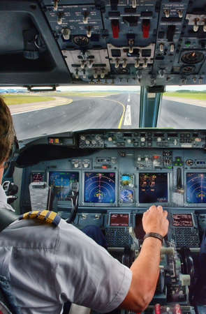 Captain pulling an aircraft throttle