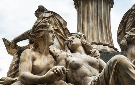 Fragments of the Pallas Athena (goddess of wisdom) fountain, in front of the Austrian Parliament Building. The figures symbolize the rivers Danube, Inn, Elbe and Moldau. Vienna, Austria, Europe.のeditorial素材