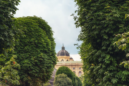 View through the trees of the Dome of the Kunsthistorisches Museum, 1891, Vienna, Austriaのeditorial素材
