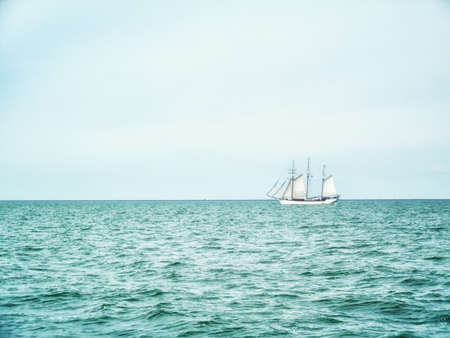 Traditional sailing in the wind on the lake Ijsselmeer in the Netherlandsの写真素材