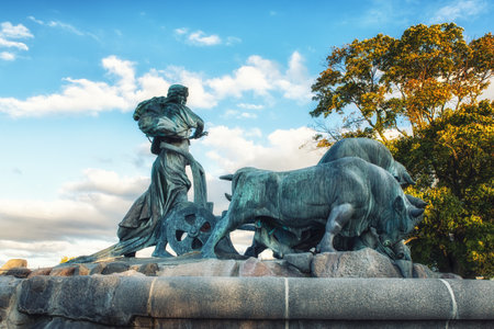 The famous Gefion Fountain (Gefionspringvandet 1899) in Copenhagen. Gefion Fountain depicting legendary Norse goddess driving four oxen. It was designed by Danish artist Anders Bundgaard. Denmarkのeditorial素材