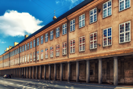?openhagen, Denmark - September 20, 2017: Sunlit colonnade outside the Danish National Museum in central Copenhagen. Pedestrians and other traffic at the end of the colonnade.のeditorial素材