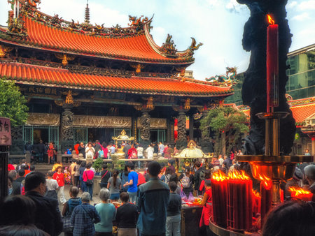 TAIPEI, TAIWAN - MARCH  02th 2018:   A crowd prays in Longshan temple in Taipei which is both dedicated to Taoism and Buddhism.のeditorial素材