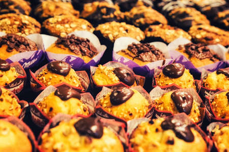 Cupcakes colorful chocolate topped muffins. Closeup and soft focus.の写真素材