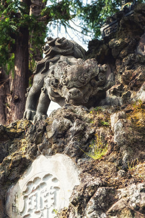Narita, Japan 17 March, 2018: An ornately carved statue of a lion. The Narita-san temple, also known as Shinsho-Ji (New Victory Temple), is Shingon Buddhist temple complex, was first established 940 in the Japanese city of Narita, east of Tokyo.のeditorial素材