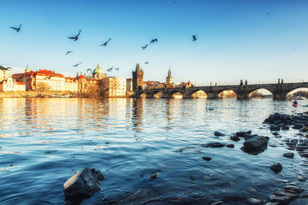 prague, Czech Republic - April 04: View of the Vltava River and the Charles bridge shined with the sunset sun, Prague, the Czech Republicのeditorial素材