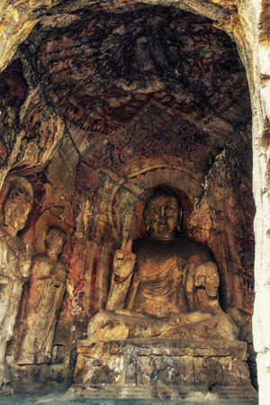 Luoyang, Hernan, China-December 25,2017 : Rock cut statue depicting Buddha granting wishes and protecting against fear. This grotto still contains the original paint for the wei dynasty. Taken in Longmen China.のeditorial素材