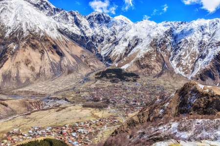 Stepansminda, Georgia  - April 15, 2017: Panoramic beautiful view of the Stepantsminda village in the mountains. Georgiaのeditorial素材