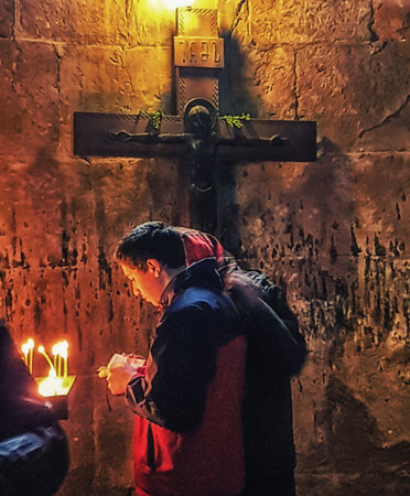 Tbilisi, Georgia  - April 13, 2017 :  A person praying in Jvari Monasteryのeditorial素材