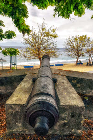 Dili (East Timor): old Portuguese cannon by the cityÂ´s beachの写真素材