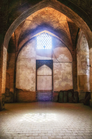 Old chamber of Taj al Molk at the Jameh Mosque beautiful interior with the brick pillars.
