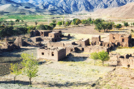Abandoned old Iranian village in the desert near the city of Yazd, made of clay walls and clay...