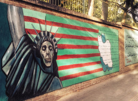 Tehran, Iran - September 29, 2015: Mural against americans on the walls of the former American Embassy in Teheran, Iran - anti-americanのeditorial素材