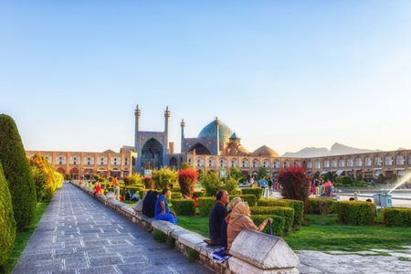 Isfahan, Iran - October 02, 2015: Iranian people rest near fountain at Naghsh-e Jahan Square.のeditorial素材