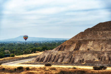 Hot Balloons at the Pyramids of the Sun  at Teotihuacan ancient historic cultural city, old ruins of...
