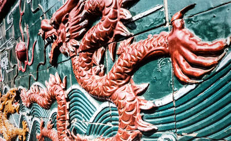 Colorful sculpture of a dragon on the wall of the Zhaojue Temple located in Chenghua District of...