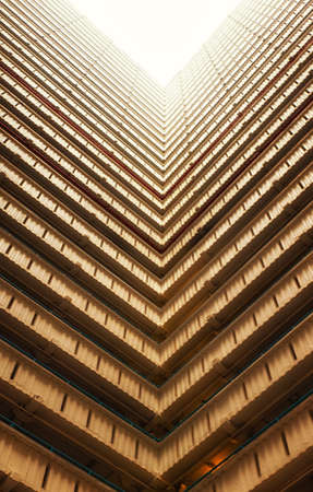 Bottoms up view of the cascading corridors opening up to the sky at an old public housing estate in...