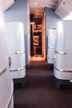 Inside passenger airplane with cockpit door open.の写真素材