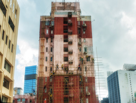 Hong Kong, China - June 26, 2019 : Workers are maintaining old building in Hong Kong.のeditorial素材