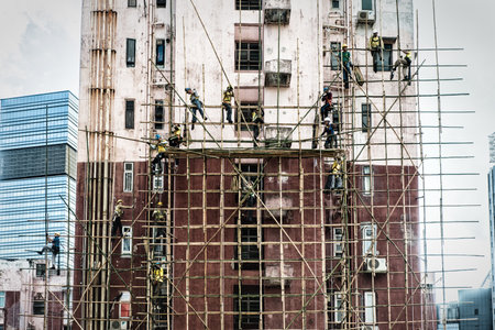 Hong Kong, China - June 26, 2019 : Workers are maintaining old building in Hong Kong.のeditorial素材