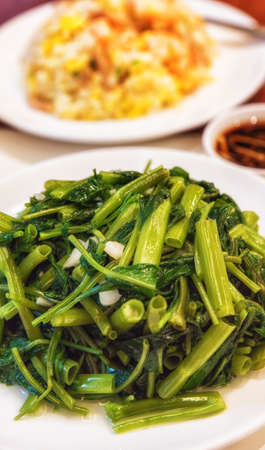 Ipomoea aquatica, known as water spinach, water morning glory, water convolvulus, ong-choy, kang-kung, or swamp cabbage, is popularly used as a green vegetable, especially in East and Southeast Asian cuisines.の写真素材