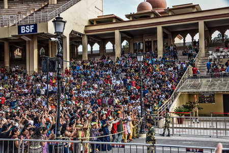 Wagah, India - March 13, 2019: Spectators at the daily India-Pakistan border ceremony of lowering of the flagsのeditorial素材