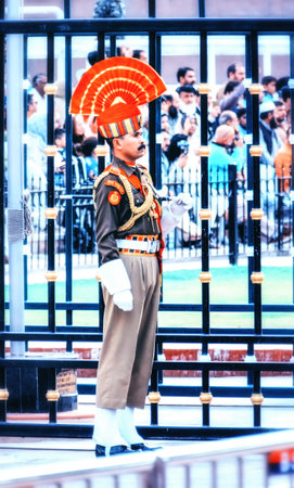Wagah, India - March 13, 2019: The marching Pakistani and Indian guards in national uniform at the ceremony of lowering the flags on the border between Pakistan and India, Wagah, Lahore, Pakistanのeditorial素材