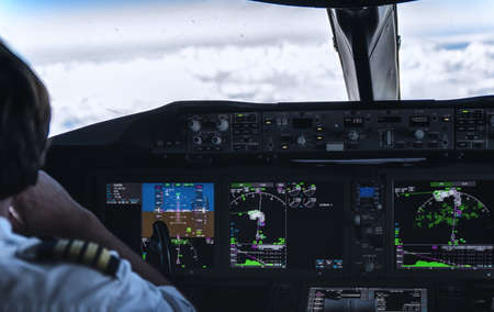 Pilots in the Cockpit above the clouds near Santiago.