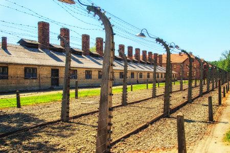 Barracks and barbed wire in a concentration camp in Auschwitz (Poland).Museum Auschwitz -...
