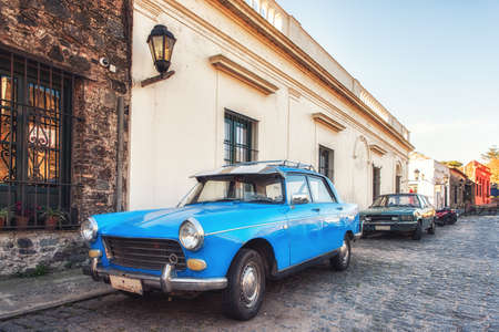 Old car parked in historic quarter of Colonia del Sacramento, Uruguay. It is one of the oldest towns in Uruguayの写真素材